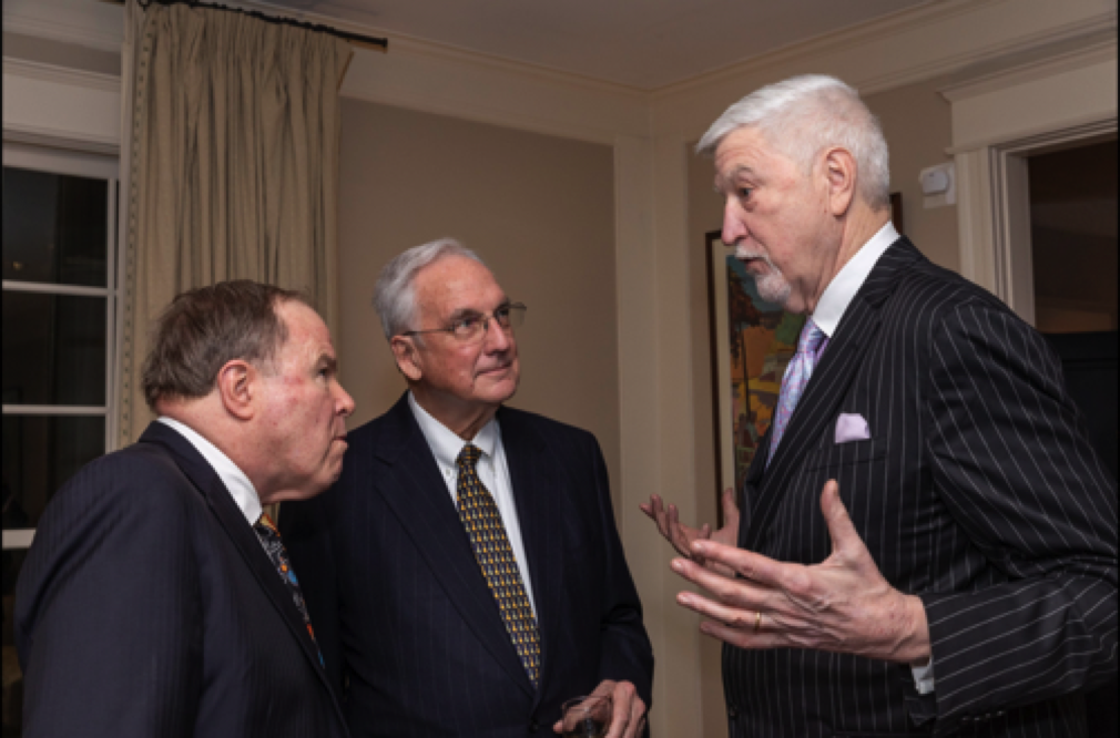 (L to R) Former undersecretary of the Army Joe Reeder and former congressmen Bob Livingston and Tom McMillen engrossed in discussion.